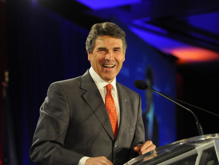 a man standing at a podium speaking