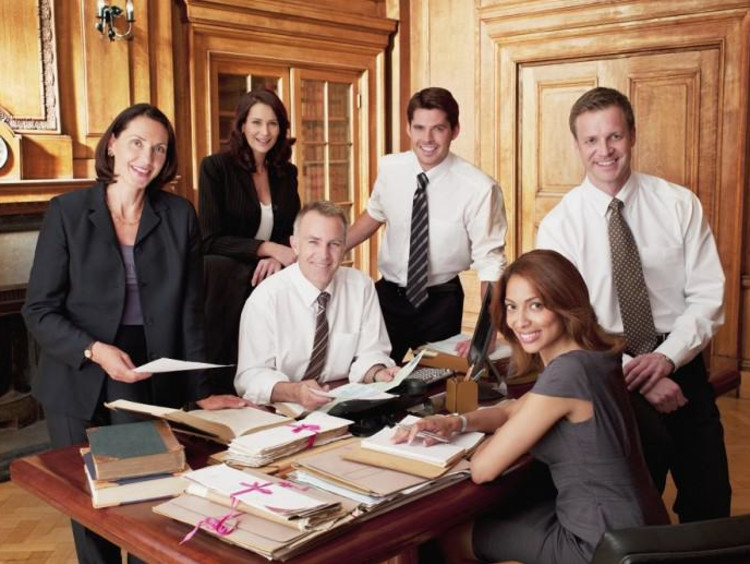 six lawyers looking over files