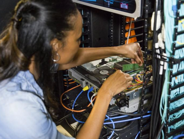girl connecting wires together