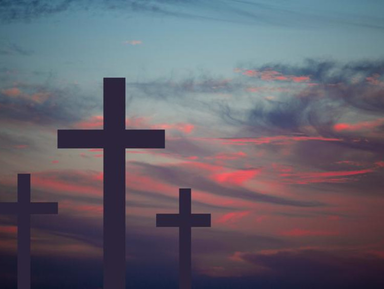 A hilltop of crosses at sunset