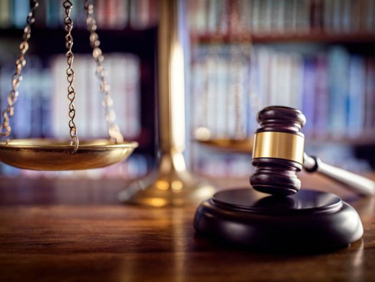 a gavel with a scale