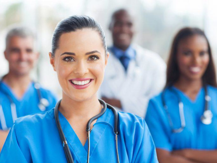 Nurses and doctor posing