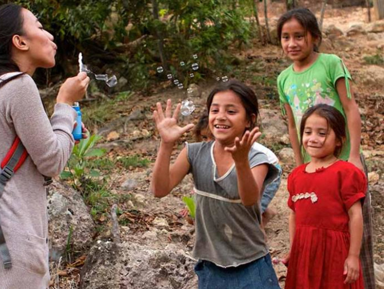 Children blowing bubbles