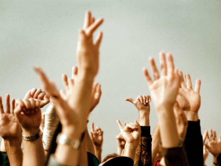 Hands raised in the air