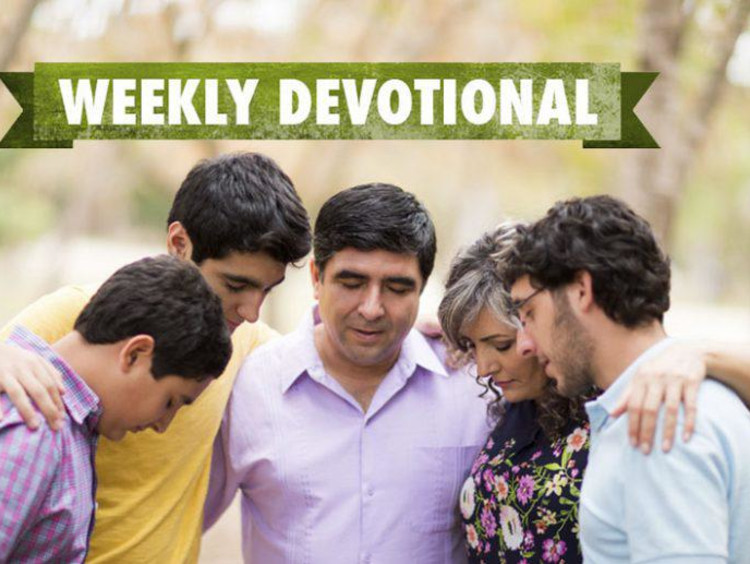 group of people praying.