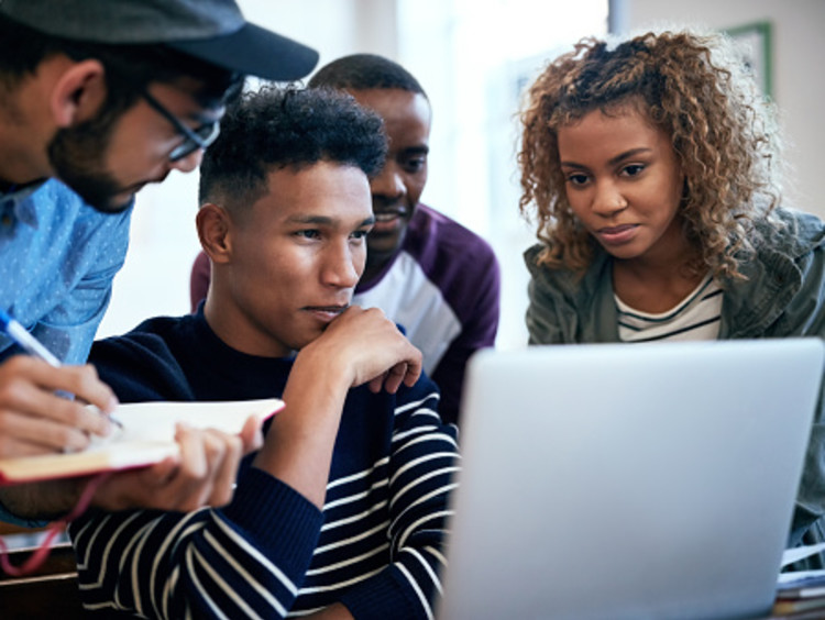 Technology degree students working on digital project