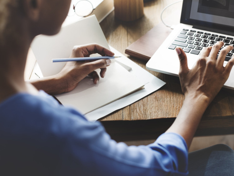A female curriculum writer creating content for a classroom