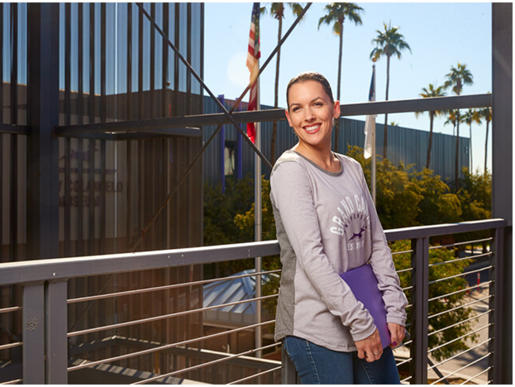 GCU mba student poses for a picture on a balcony