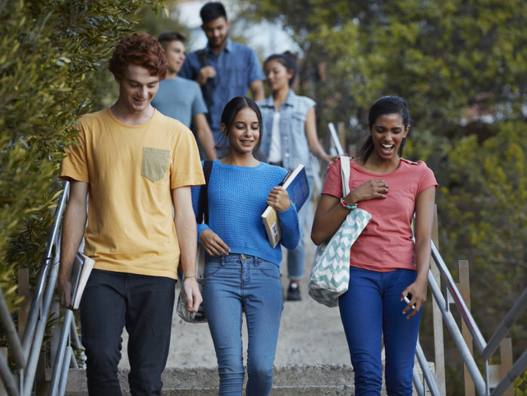 students walking and discussing which college major to choose