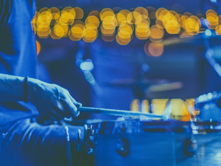 Drummer preparing to play music