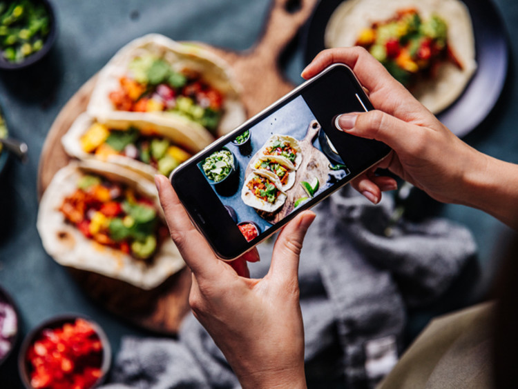 Content creator taking photo for social media