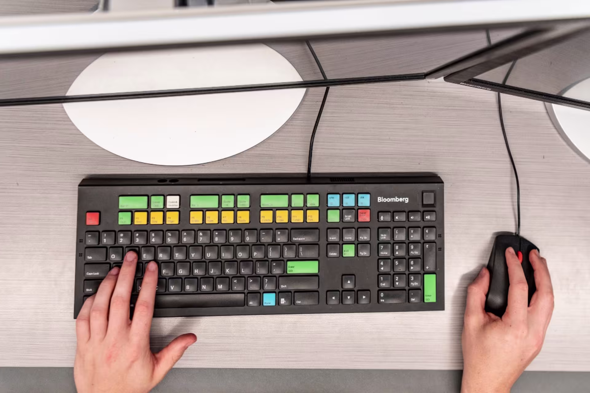 Student hands working on computer keyboard and mouse