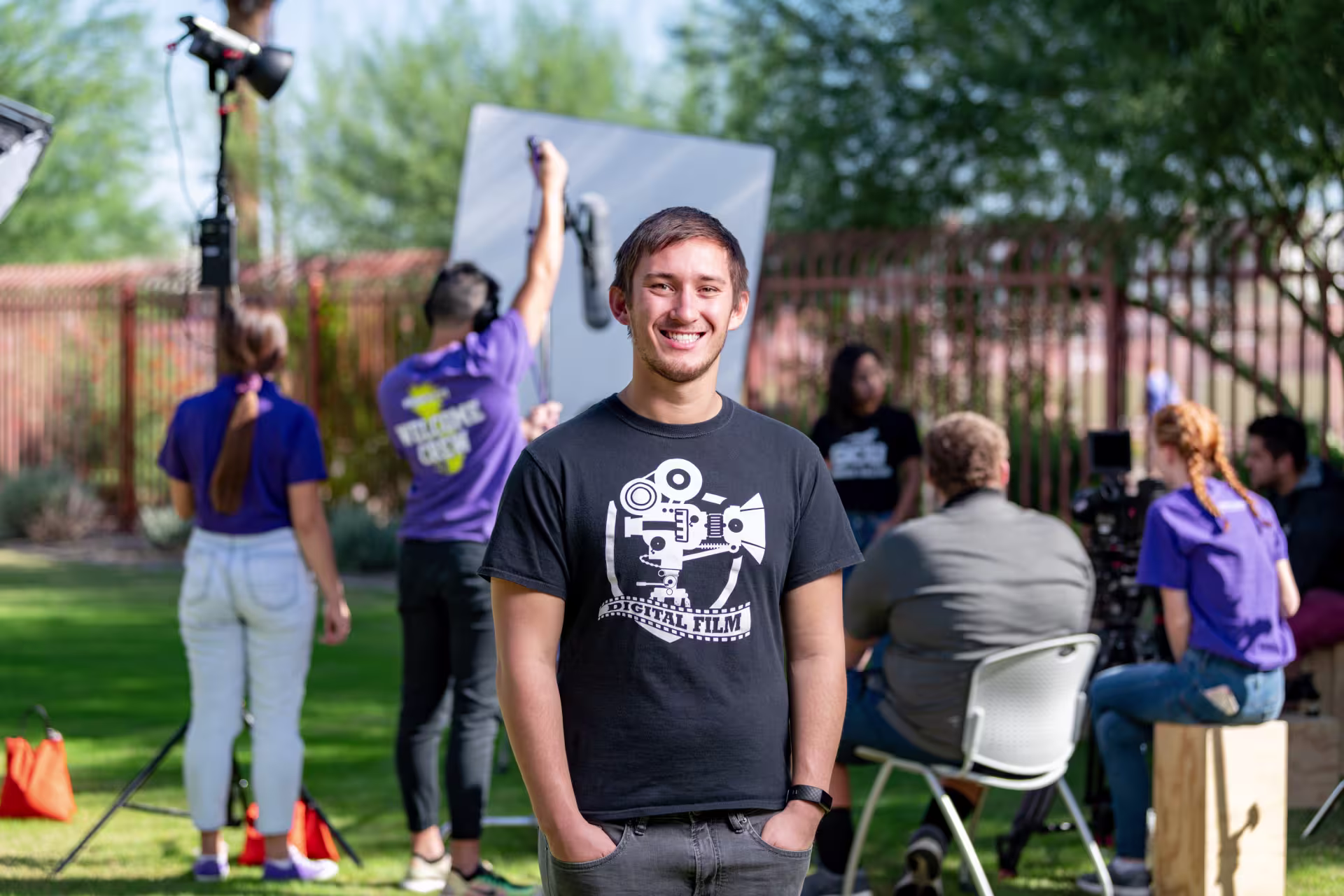 Screenwriting student standing in front of filming location