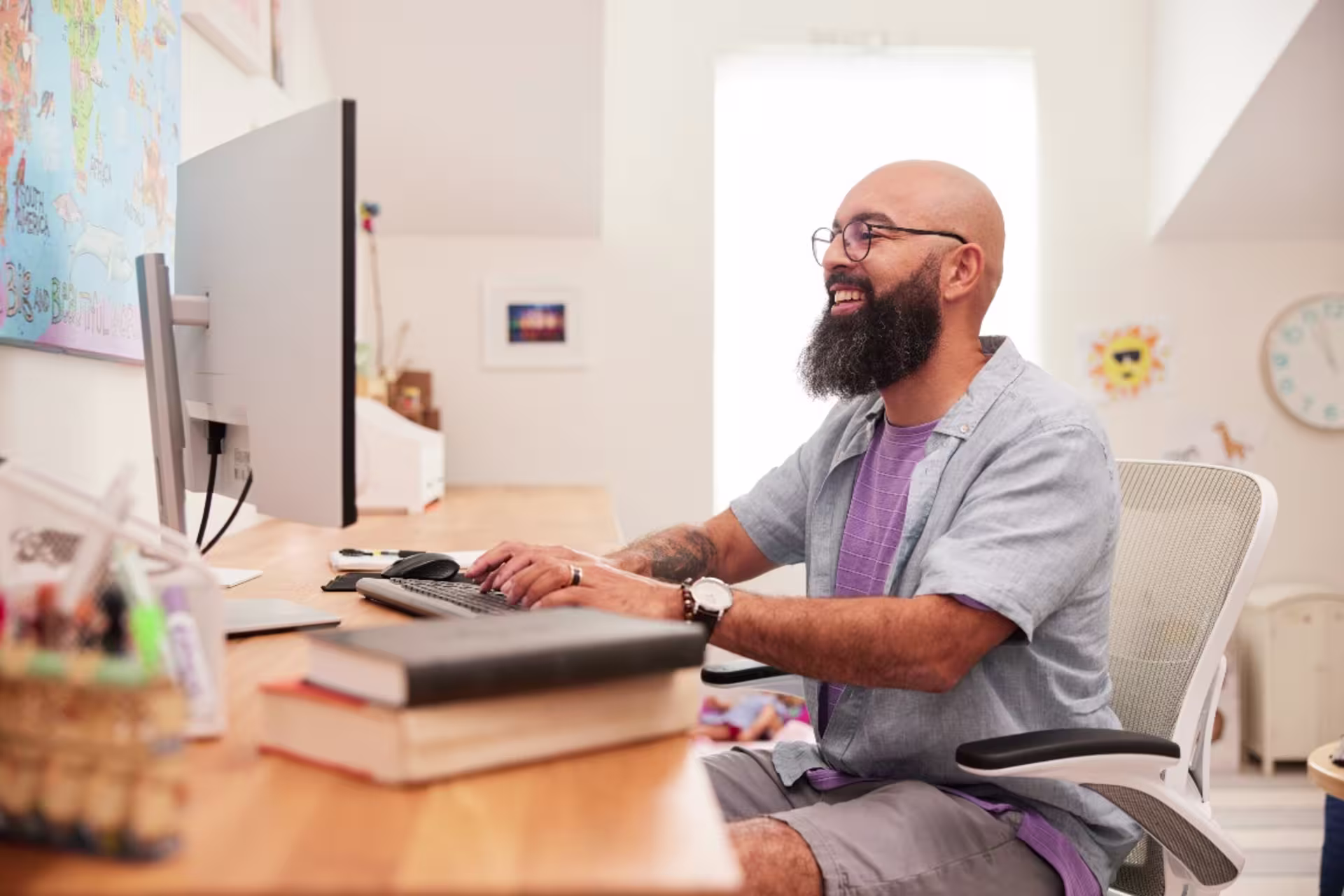 Sociology student completing online coursework at home on computer