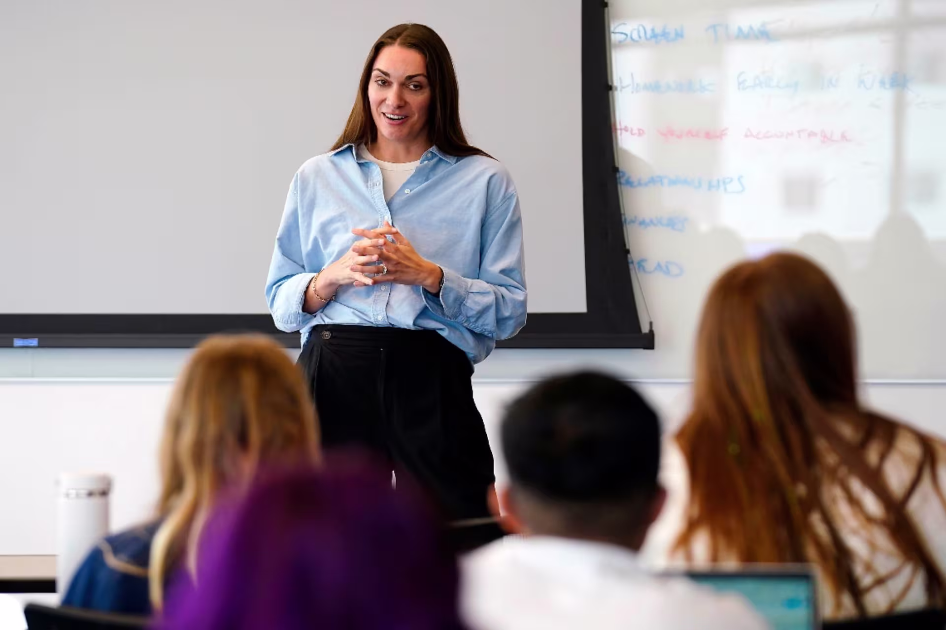 Prevention counselor standing in front of students in a classroom setting