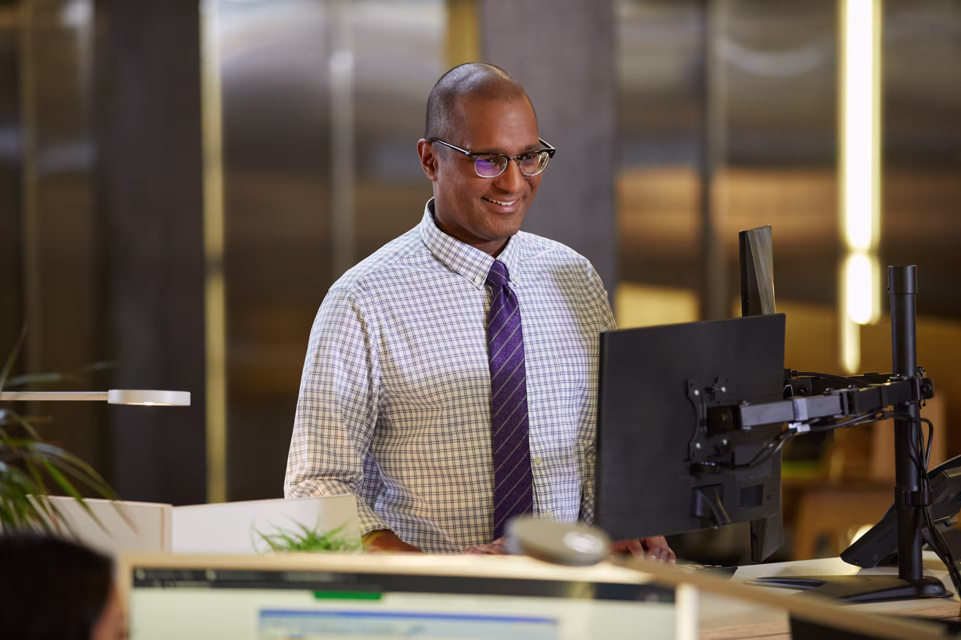 accounting tax student smiling at desk