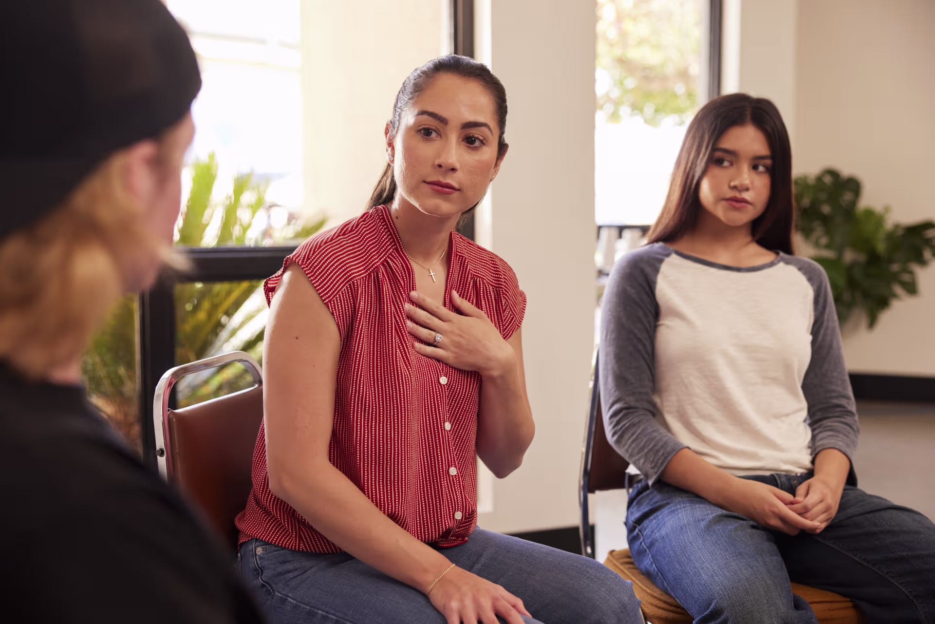 counselor listening to teen patients