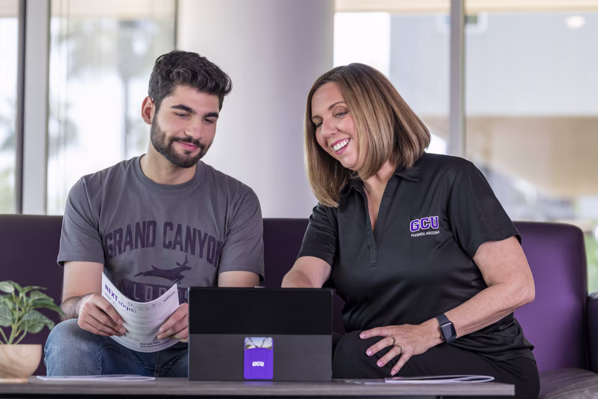 Counselor helping male student