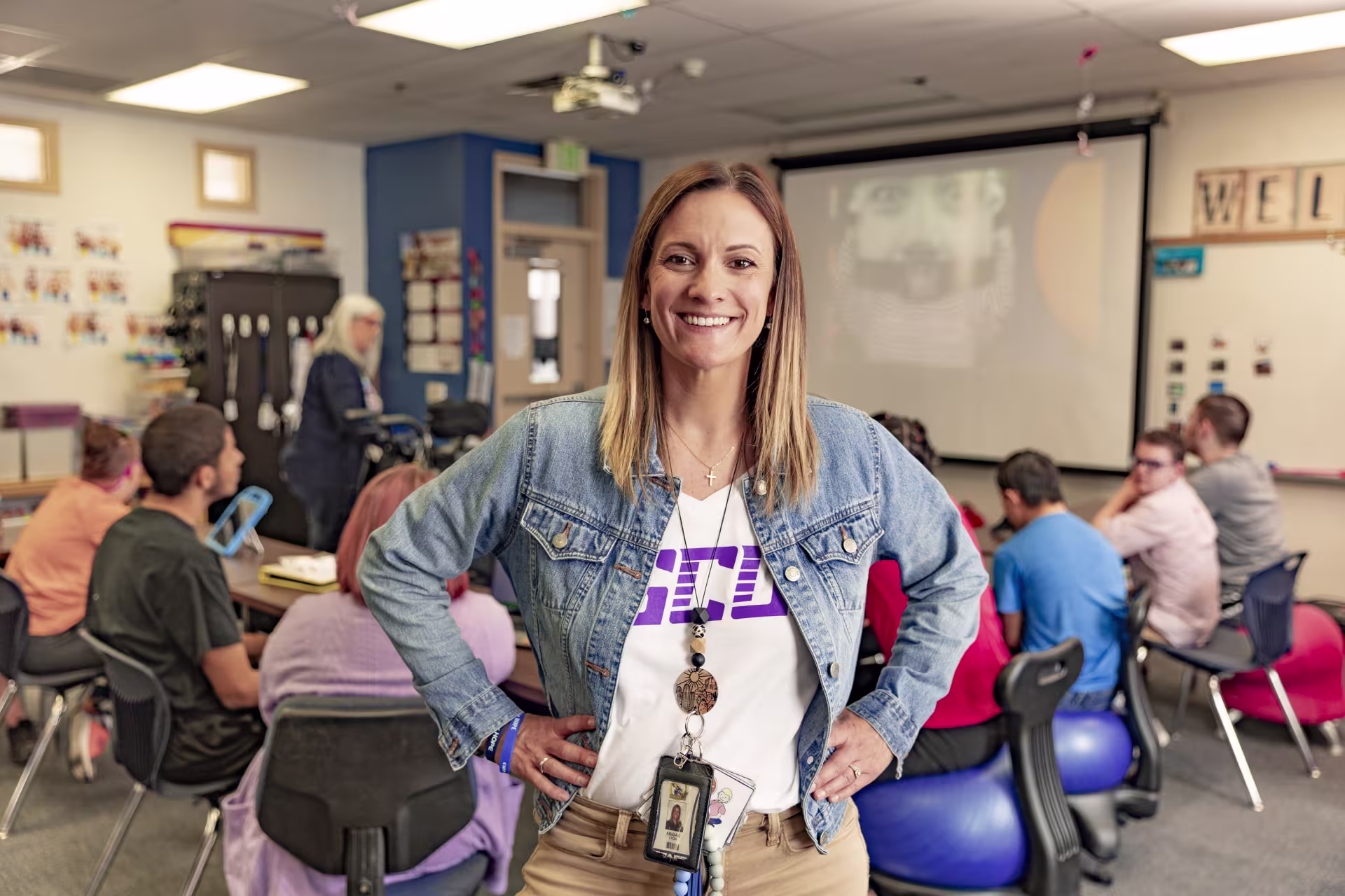 secondary english teacher smiling in classroom