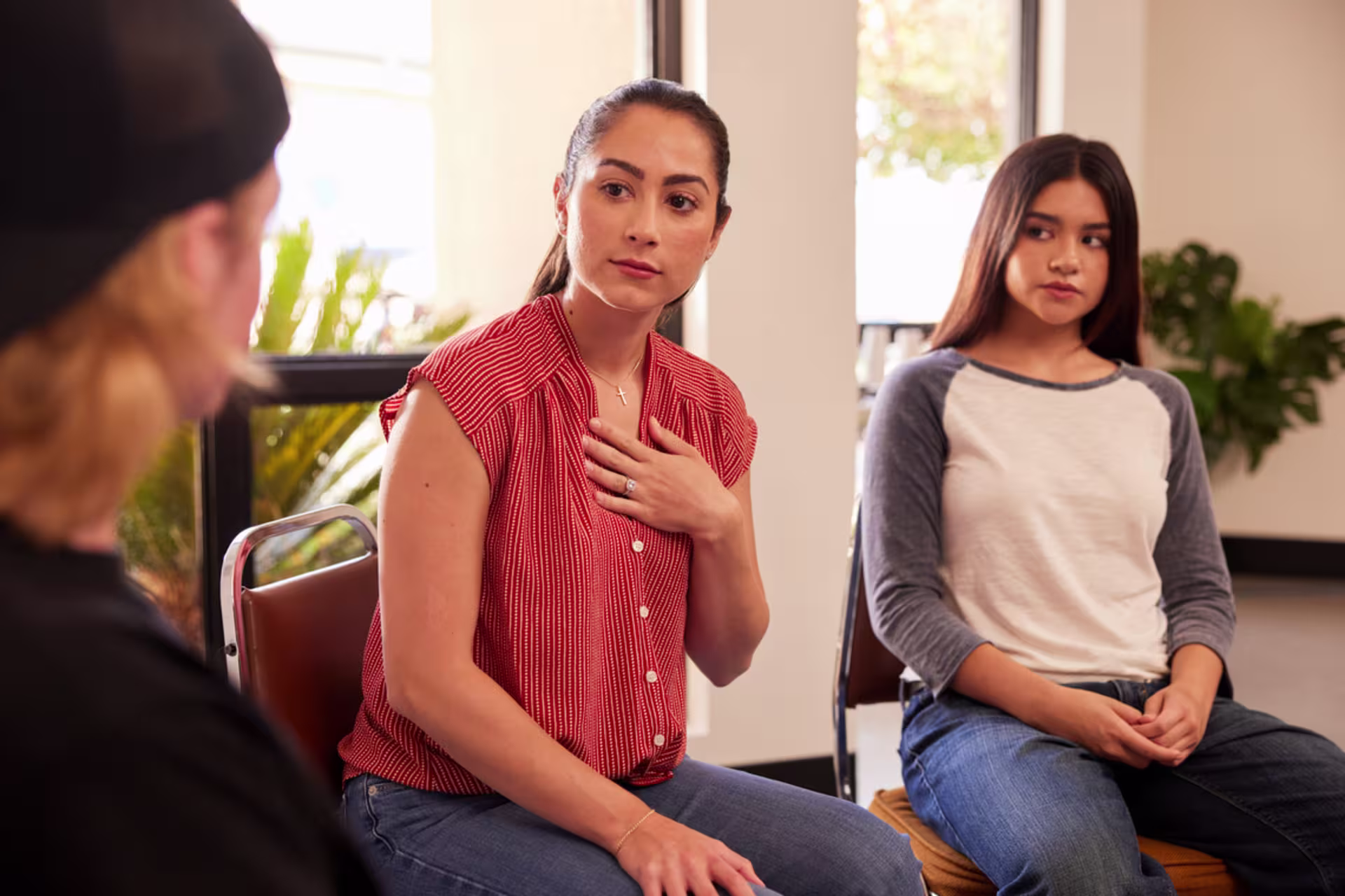 teen counselor is touched to hear status report in youth group session