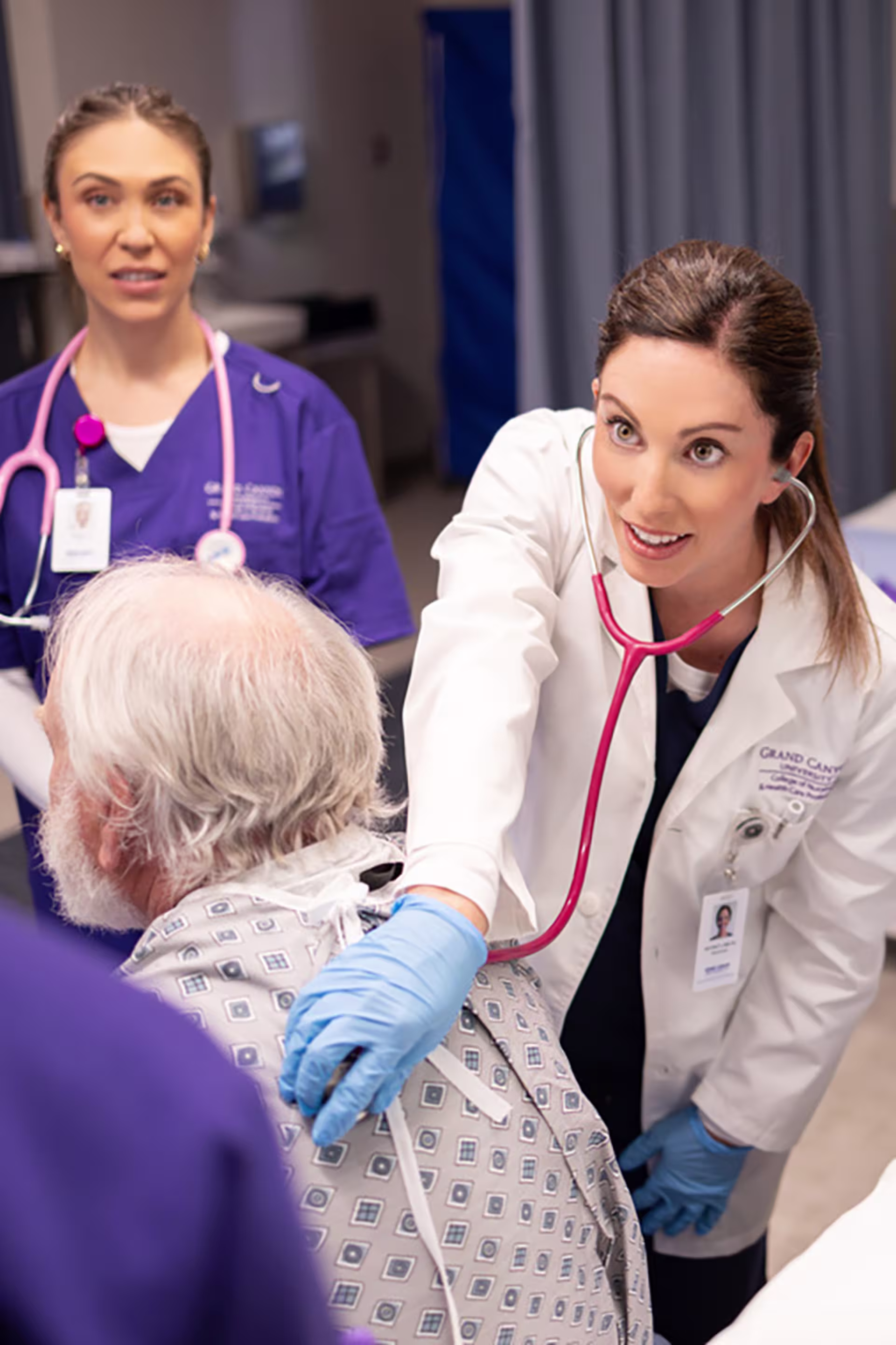 absn clinical lead checks does lung check on older man with students observing
