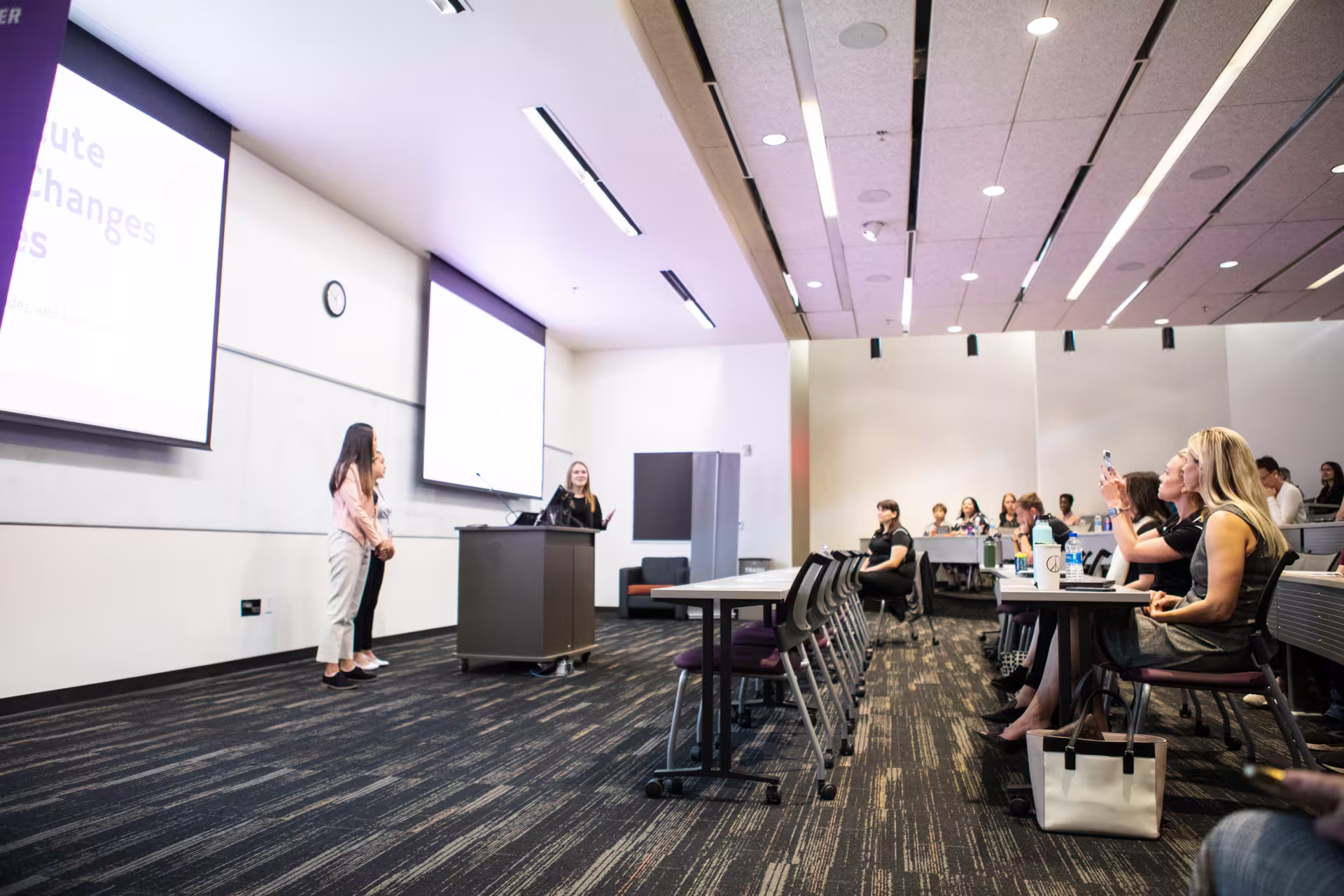 CIRT Faculty giving a presentation in a lecture hall