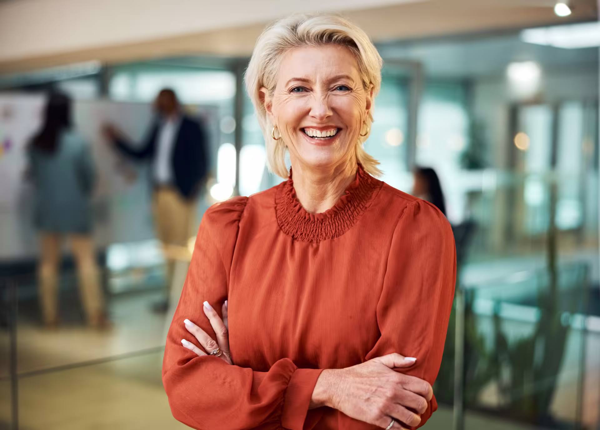 Woman with a DBA smiles in an office setting