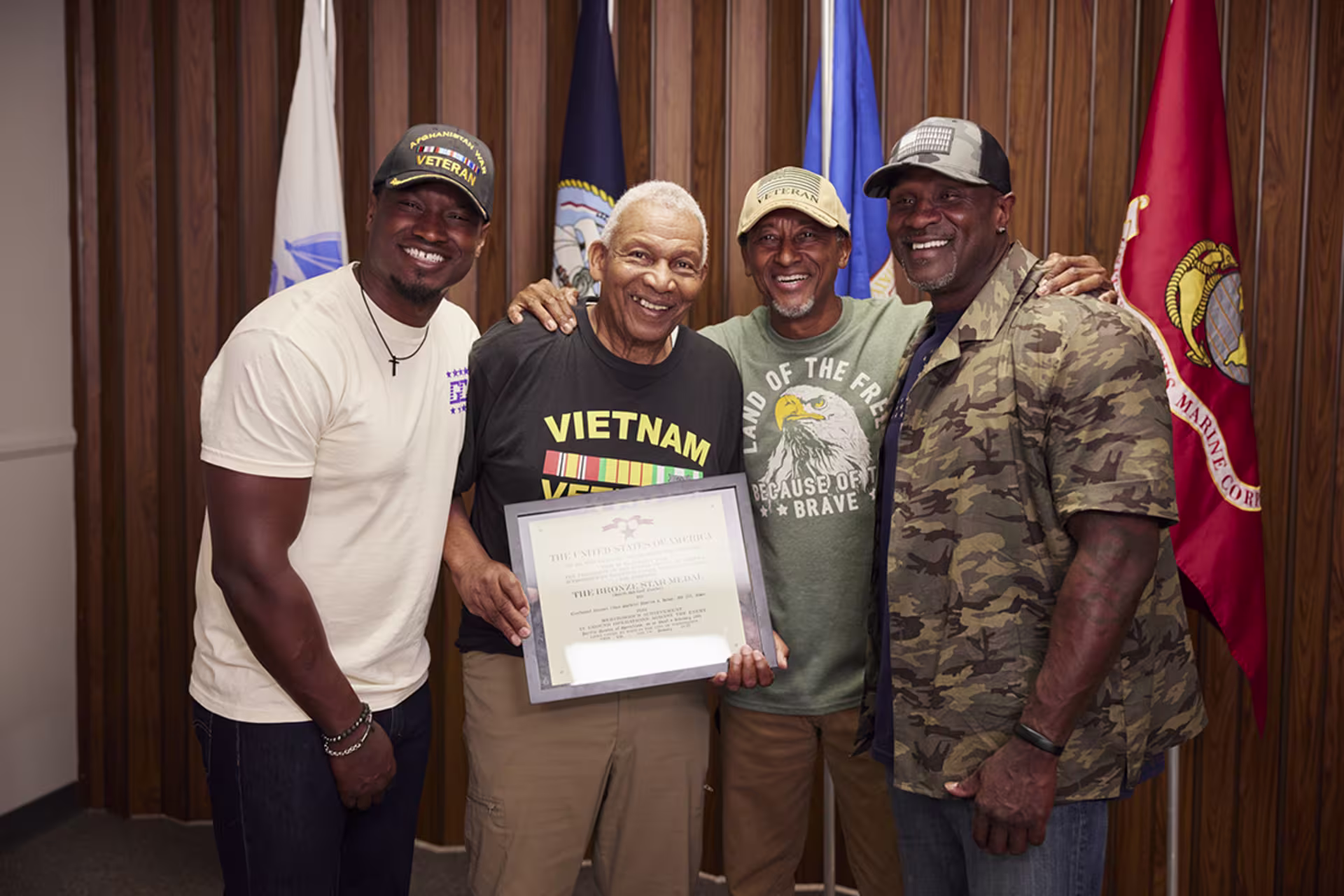 Male veterans posing and smiling for camera