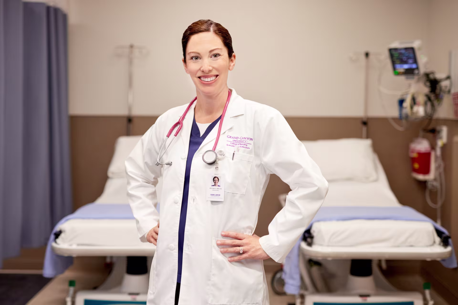 Headshot of female healthcare professional in white coat