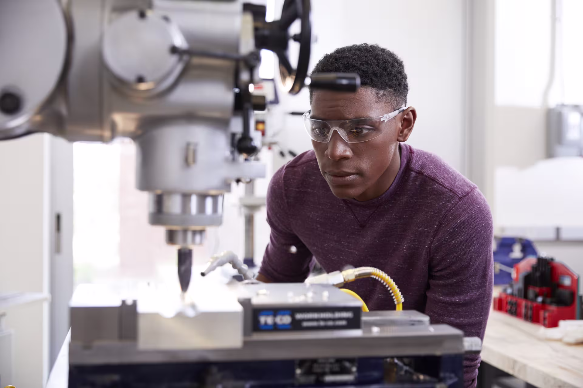 Engineer student works at equipment