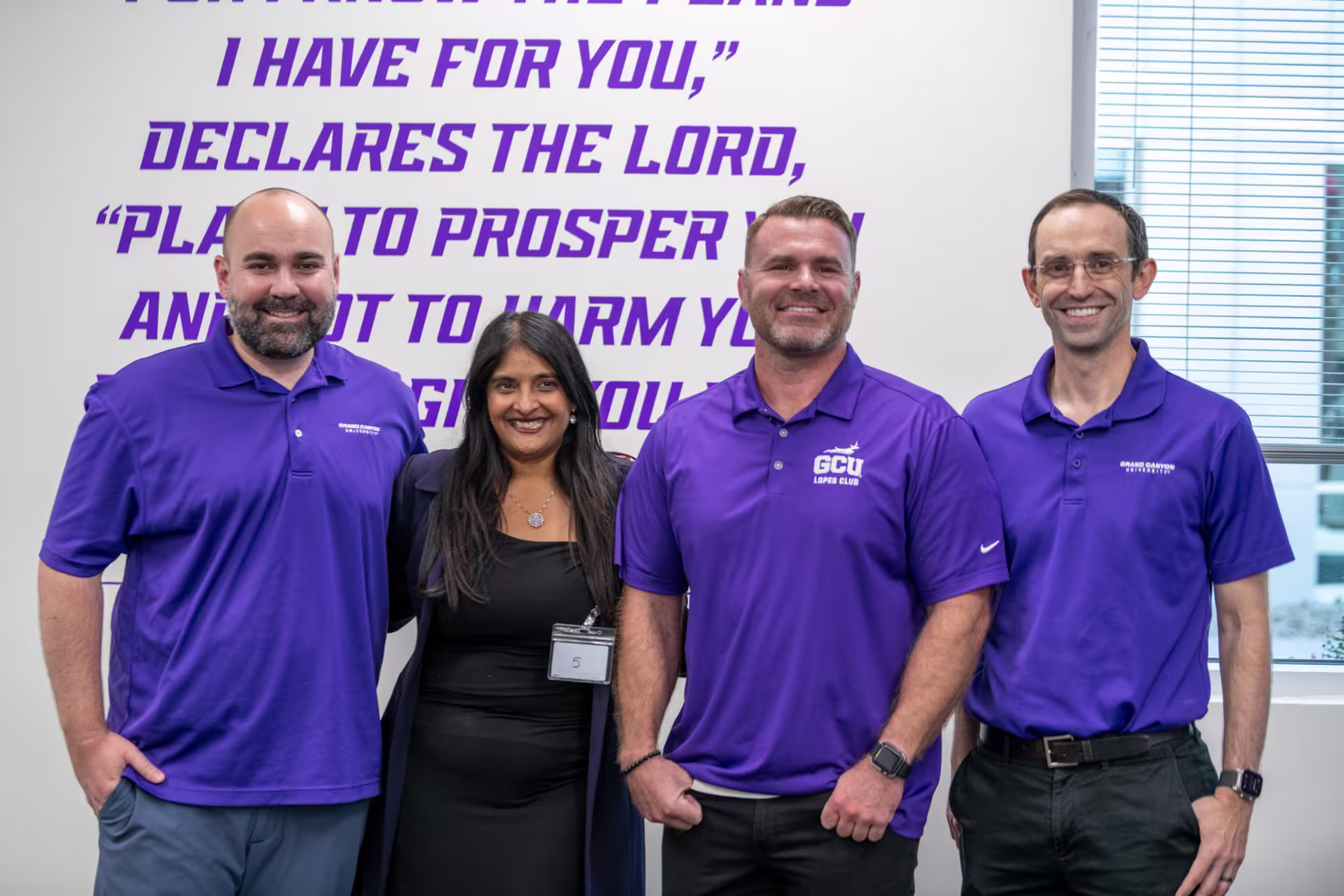 Male and female evening degree students smiling in classroom