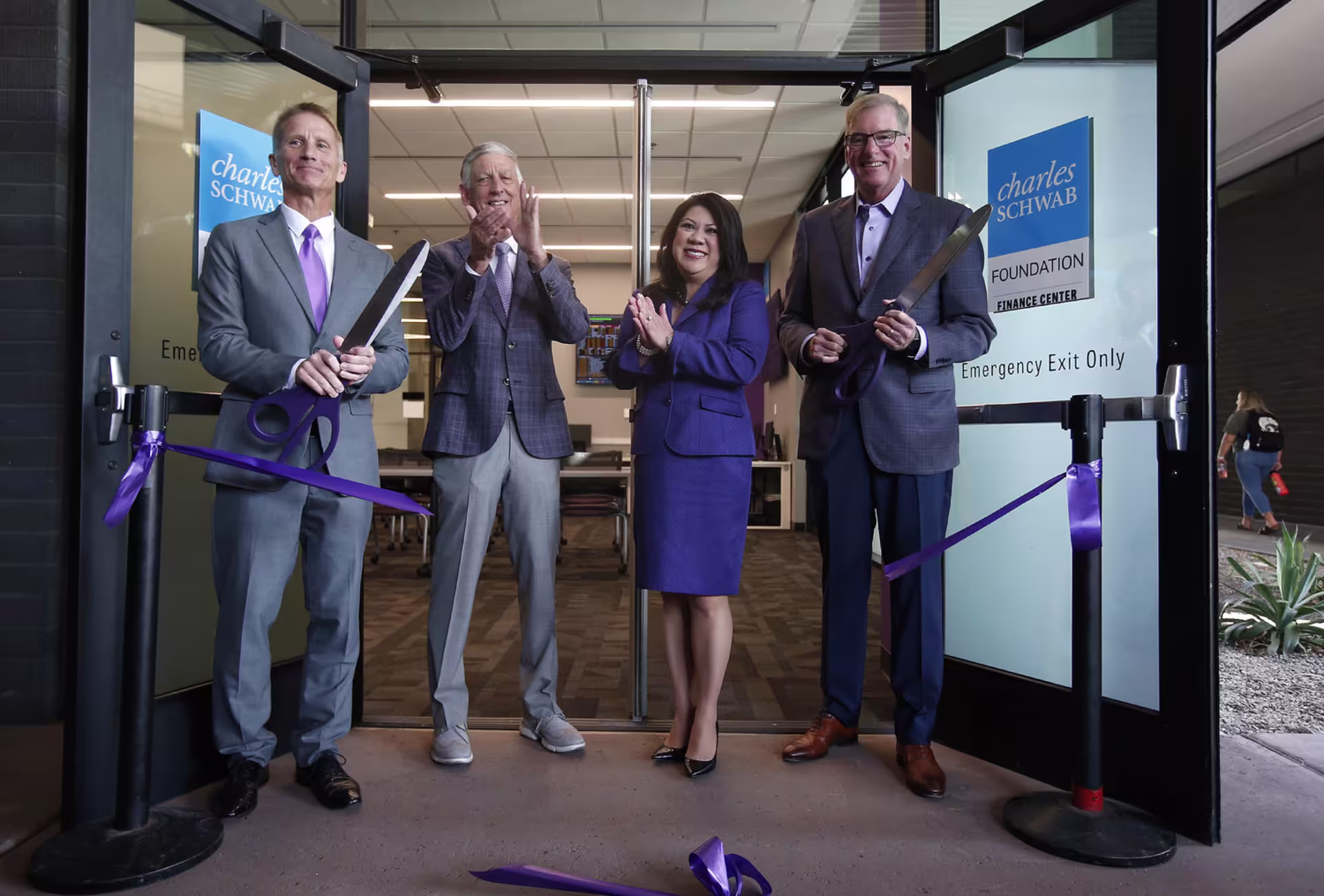 Dr. Randy Gibb, Brian Mueller and other leaders cutting ribbon for new foundation.