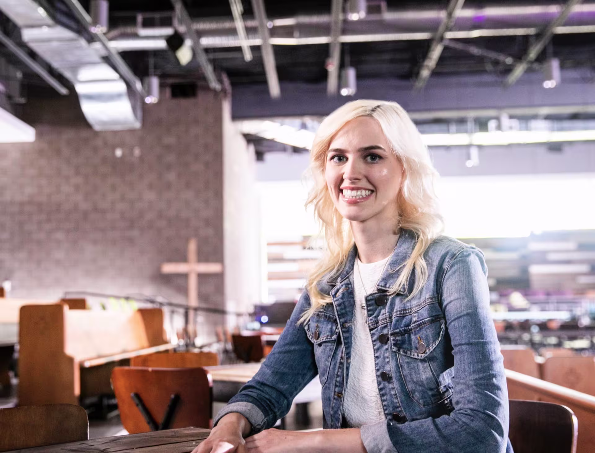Female theology student sitting in pew