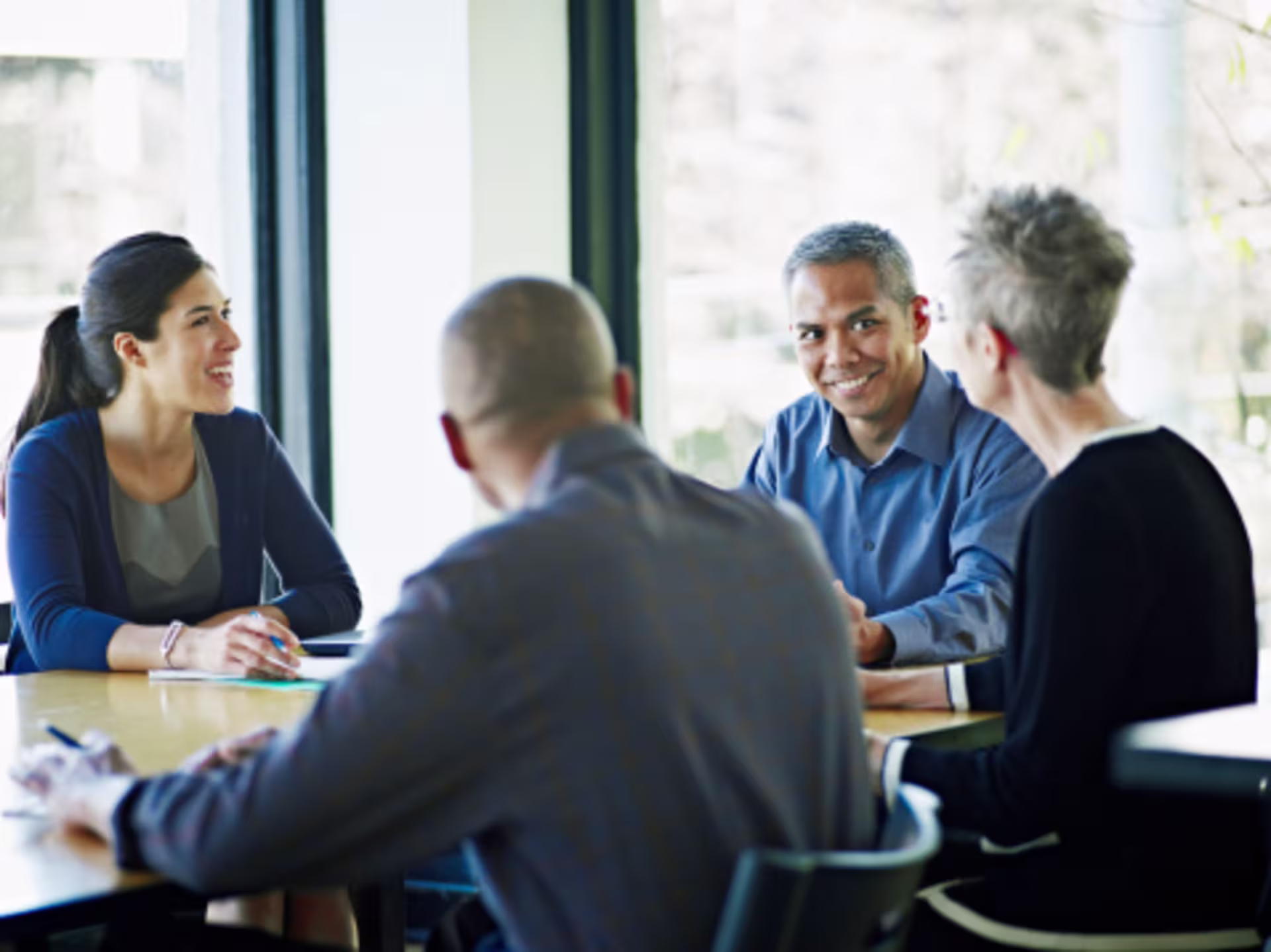 Account coordinators speaking with one another about their responsibilities