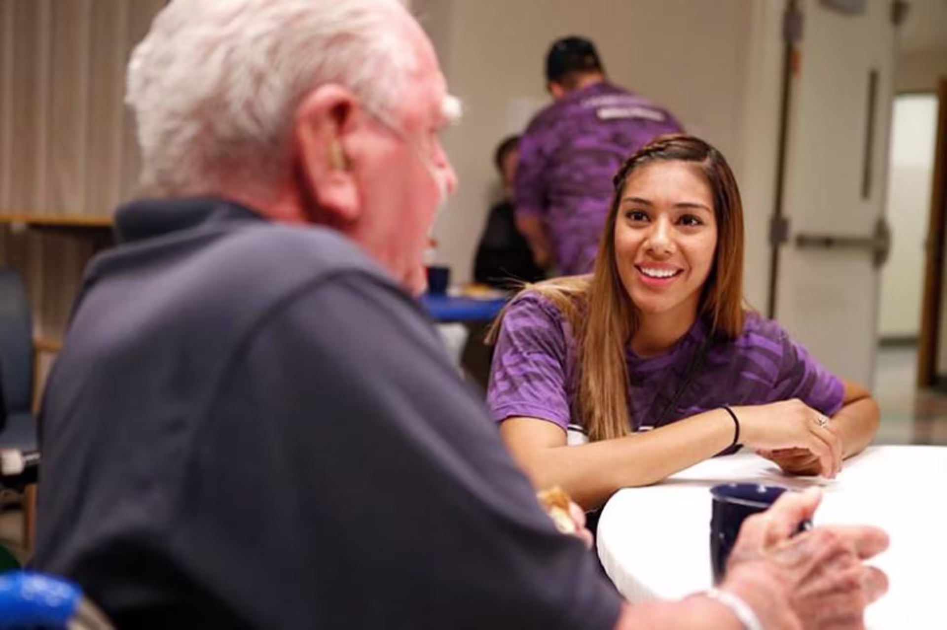 woman talking with an older man