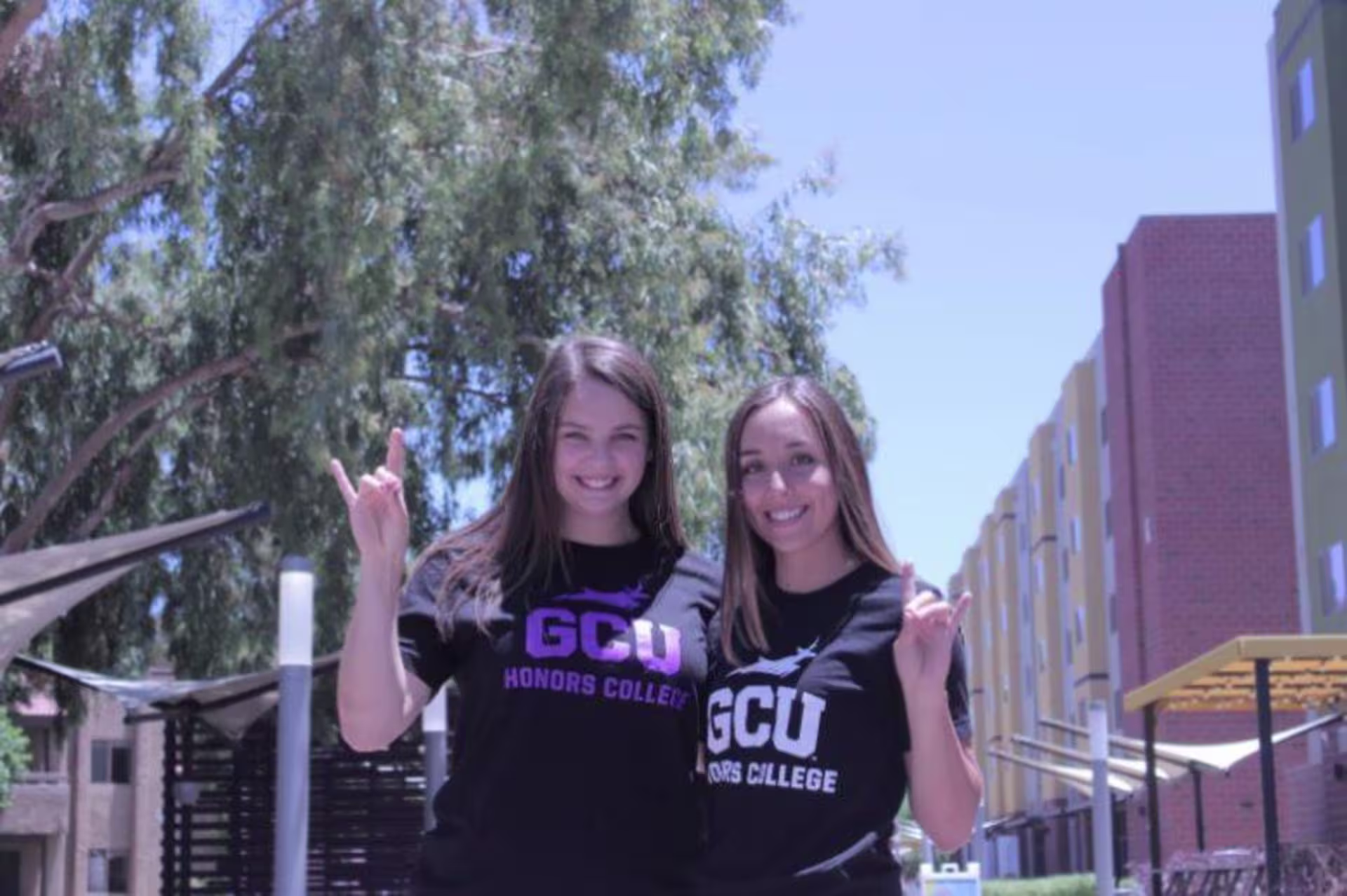 two girls holding a lopes up