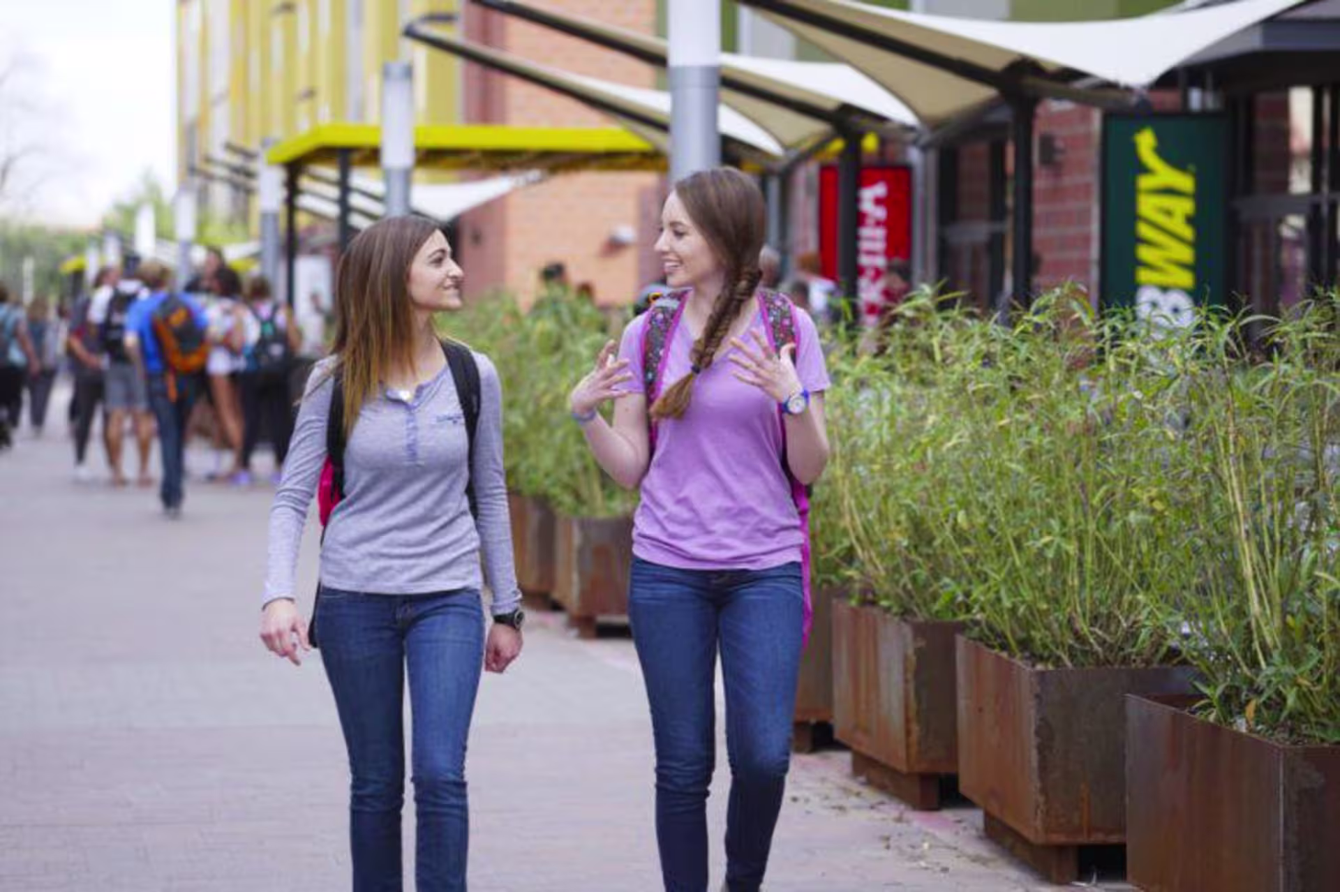 Two GCU girls walking on campus