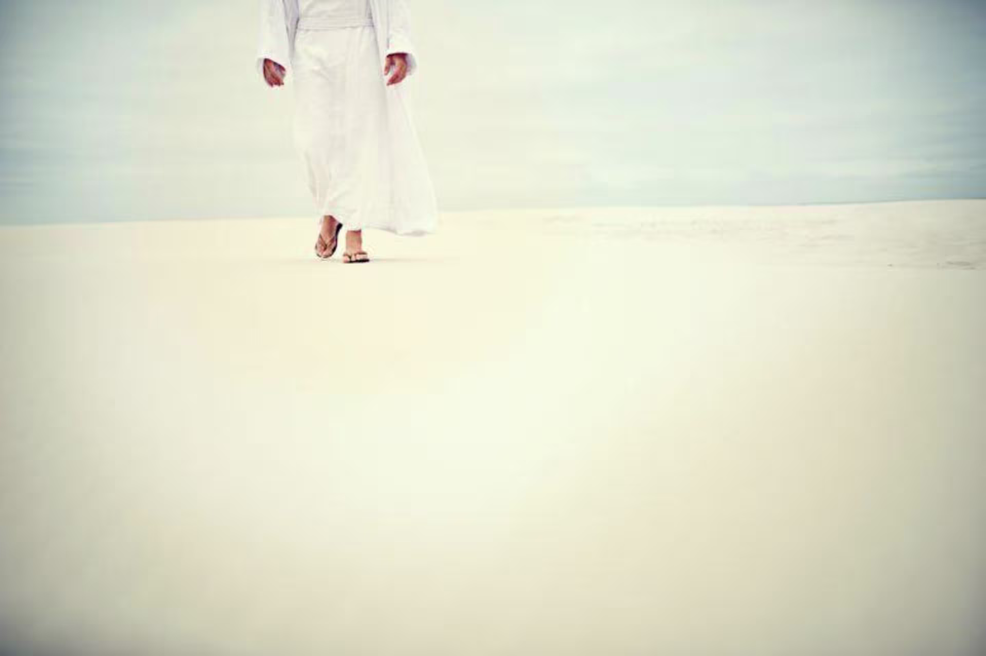 Jesus walking on sand