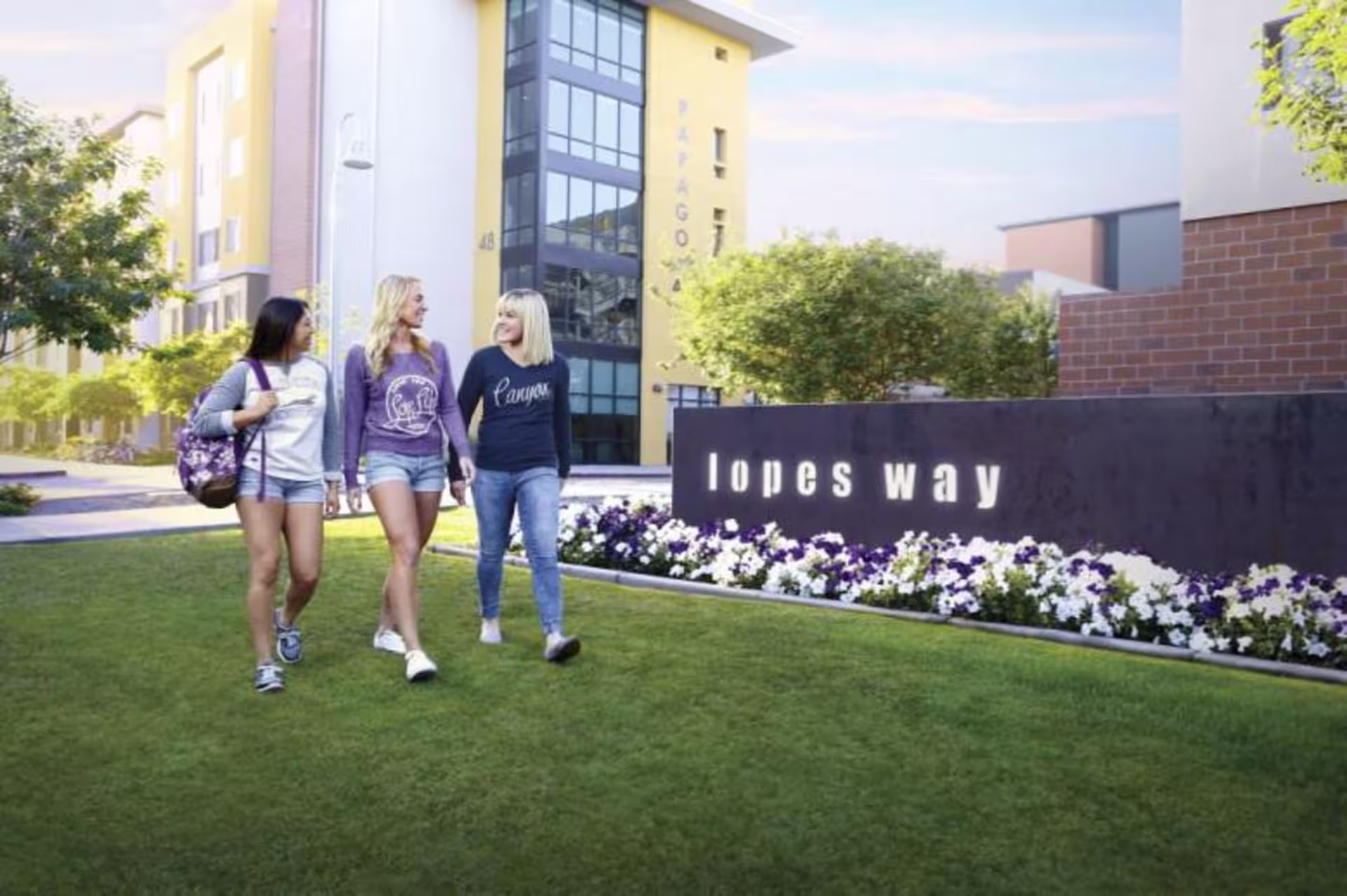 three GCU students walking on lopes way