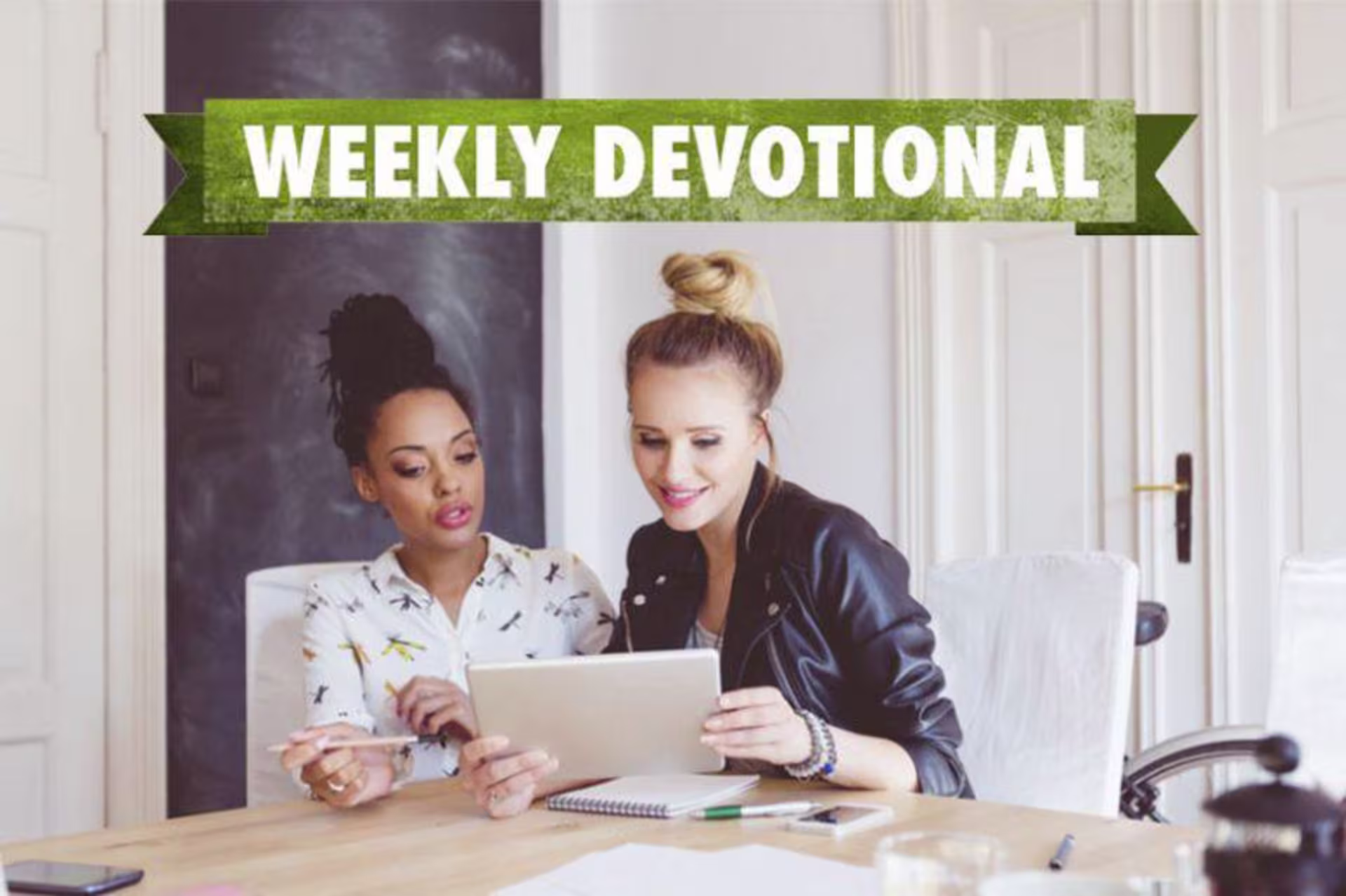 girls looking at a piece of paper