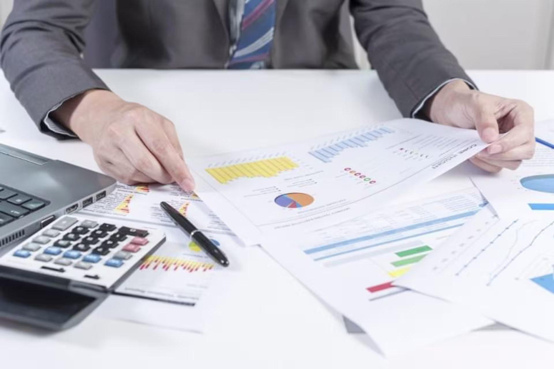 analyst with a finance degree reviewing data