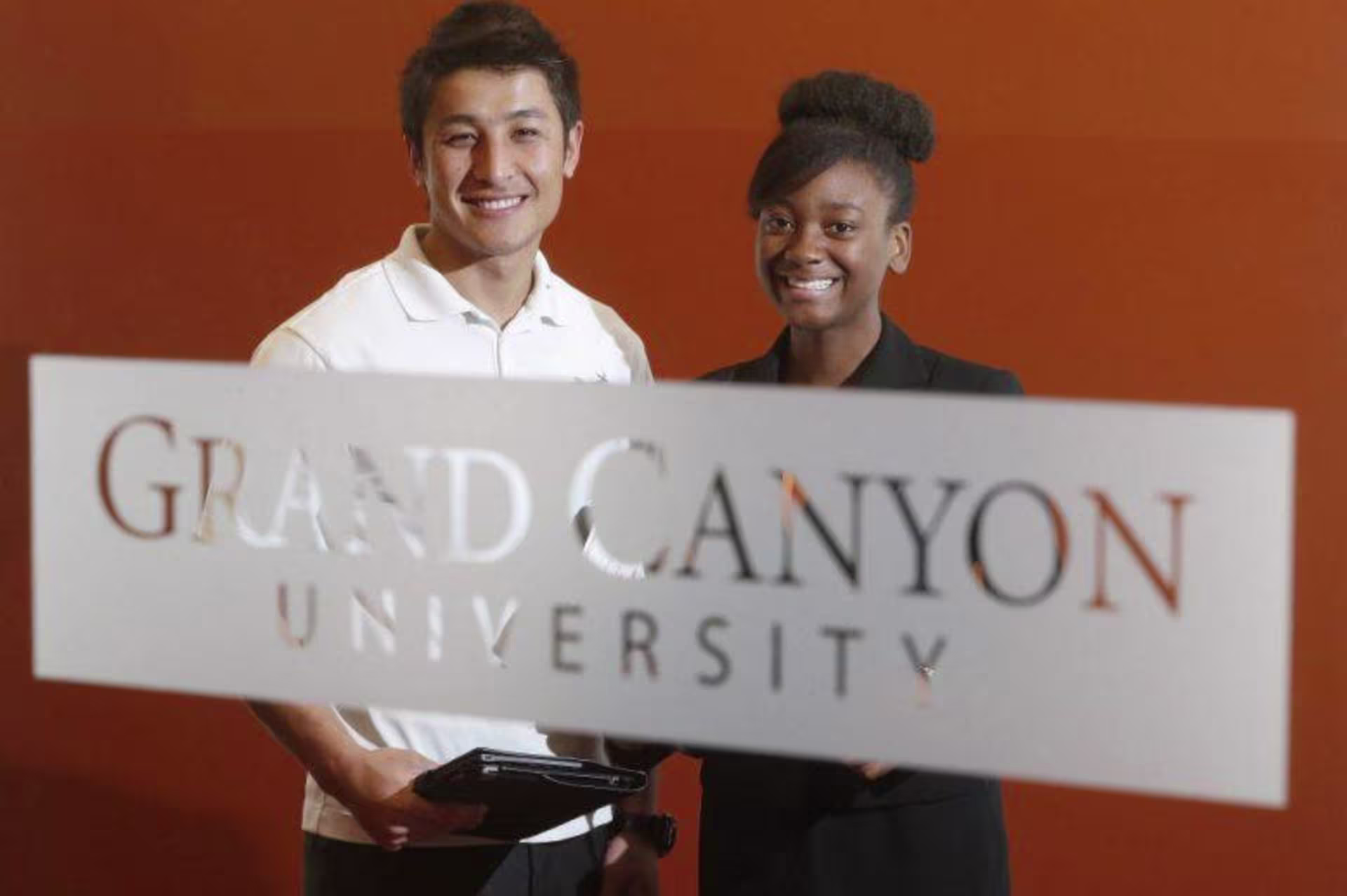 two GCU students smiling