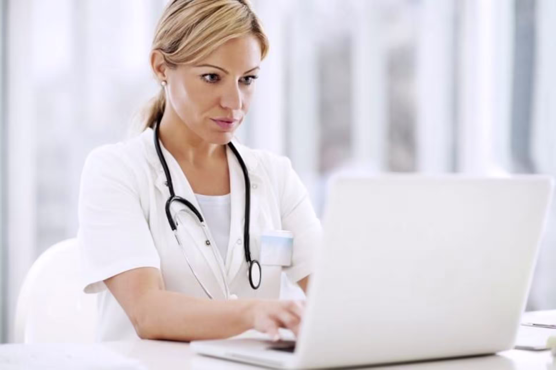 Young Adult looks at Laptop