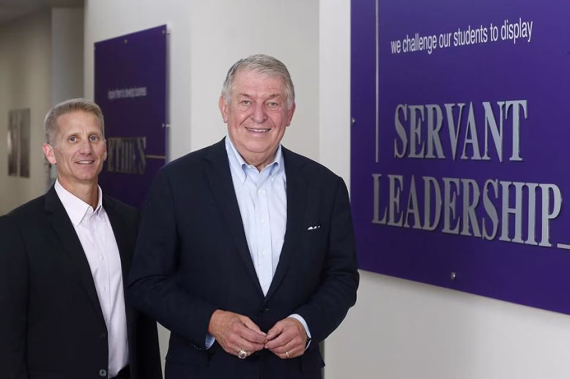 Dr. Gibb and Jerry Coangelo next to CCOB's Servant Leadership pillar