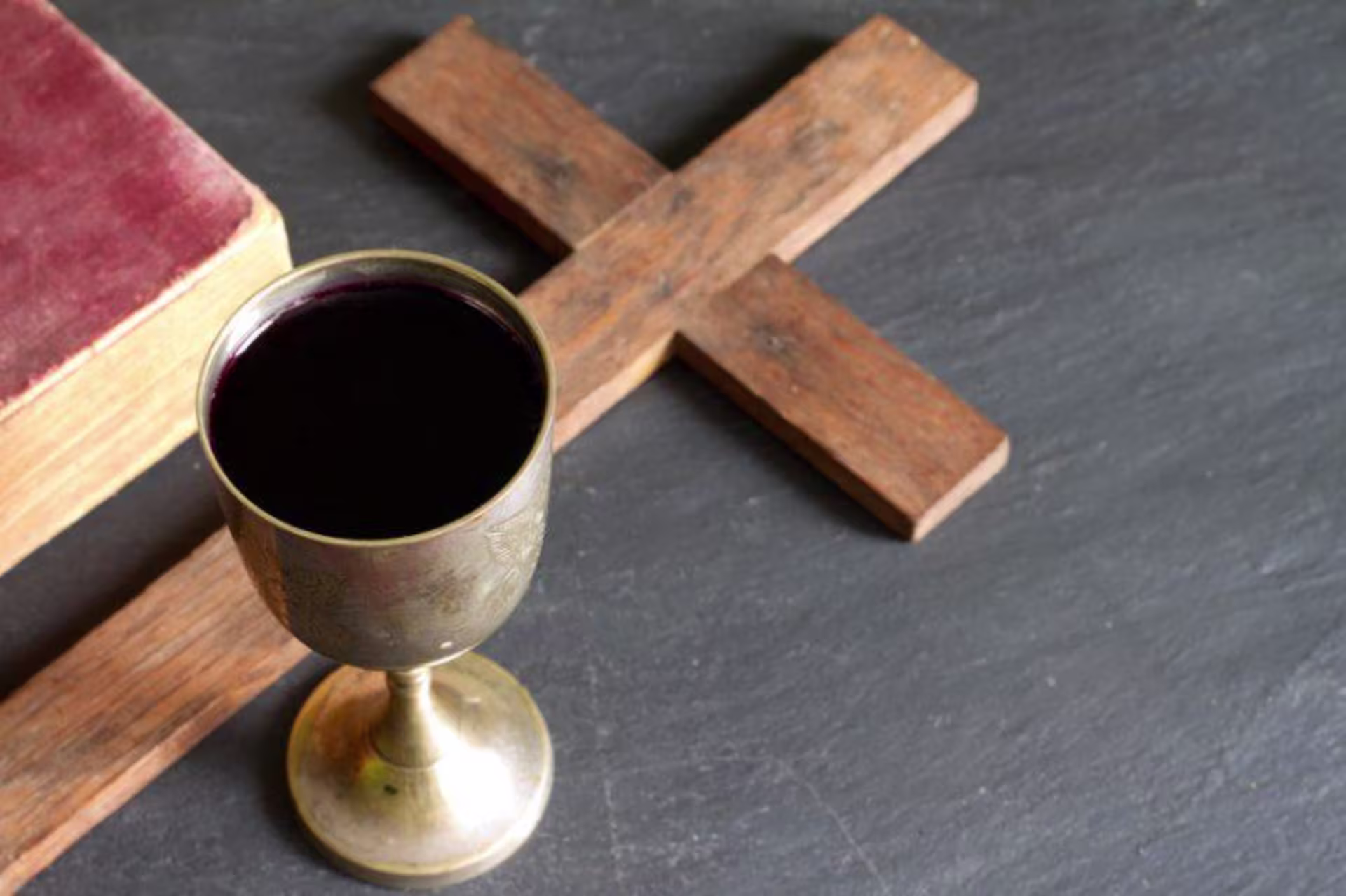 Wine and cross with bible
