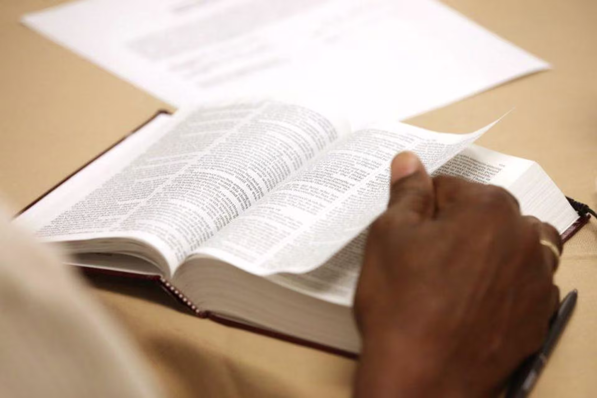 A man reading an open Bible