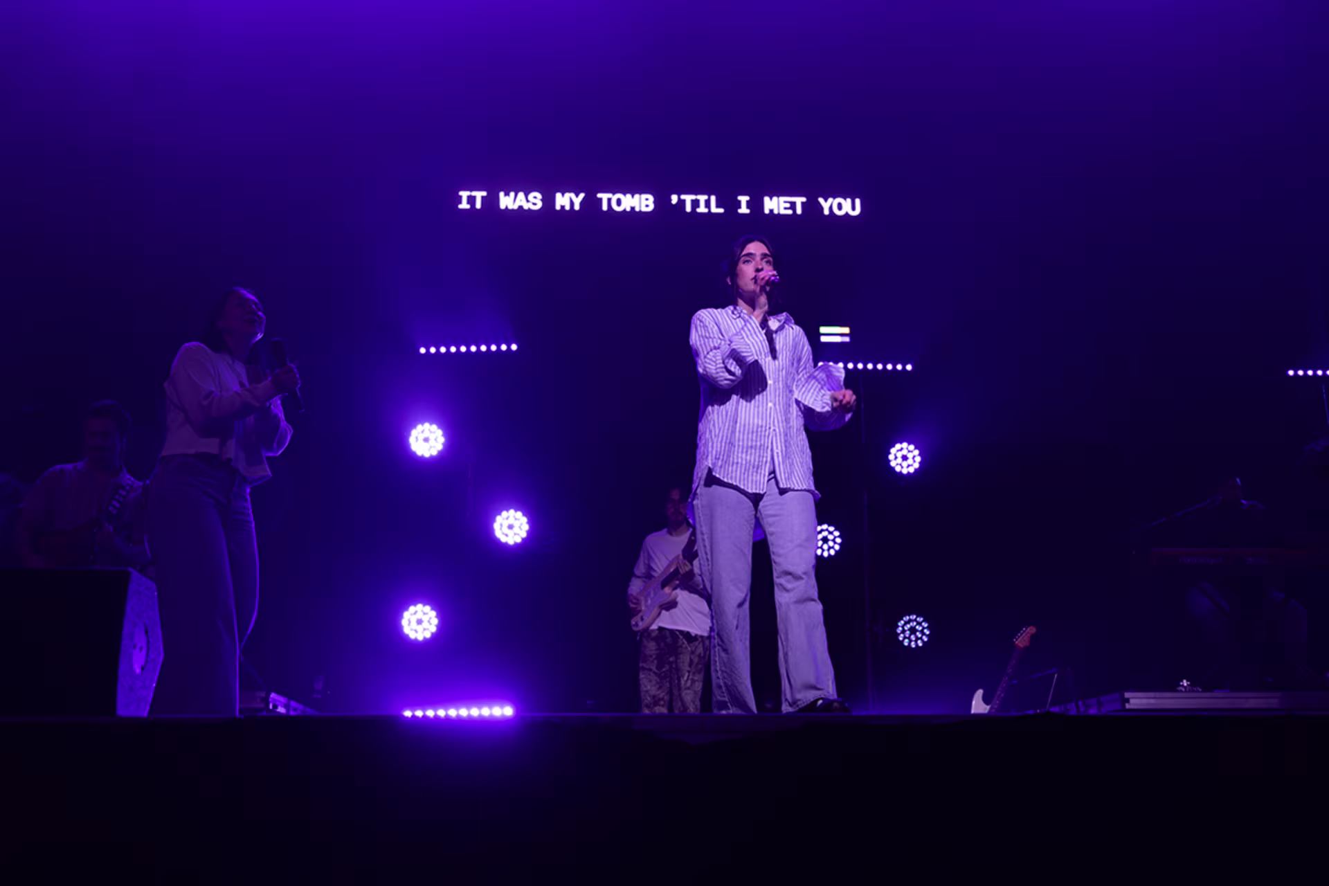 Female student singing on stage