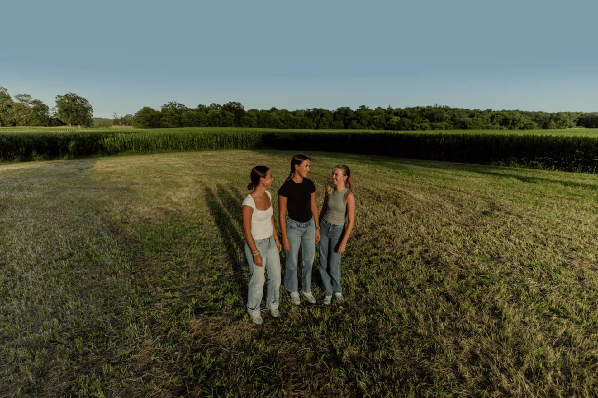 ms in sustainability new students standing in gcu farm field.