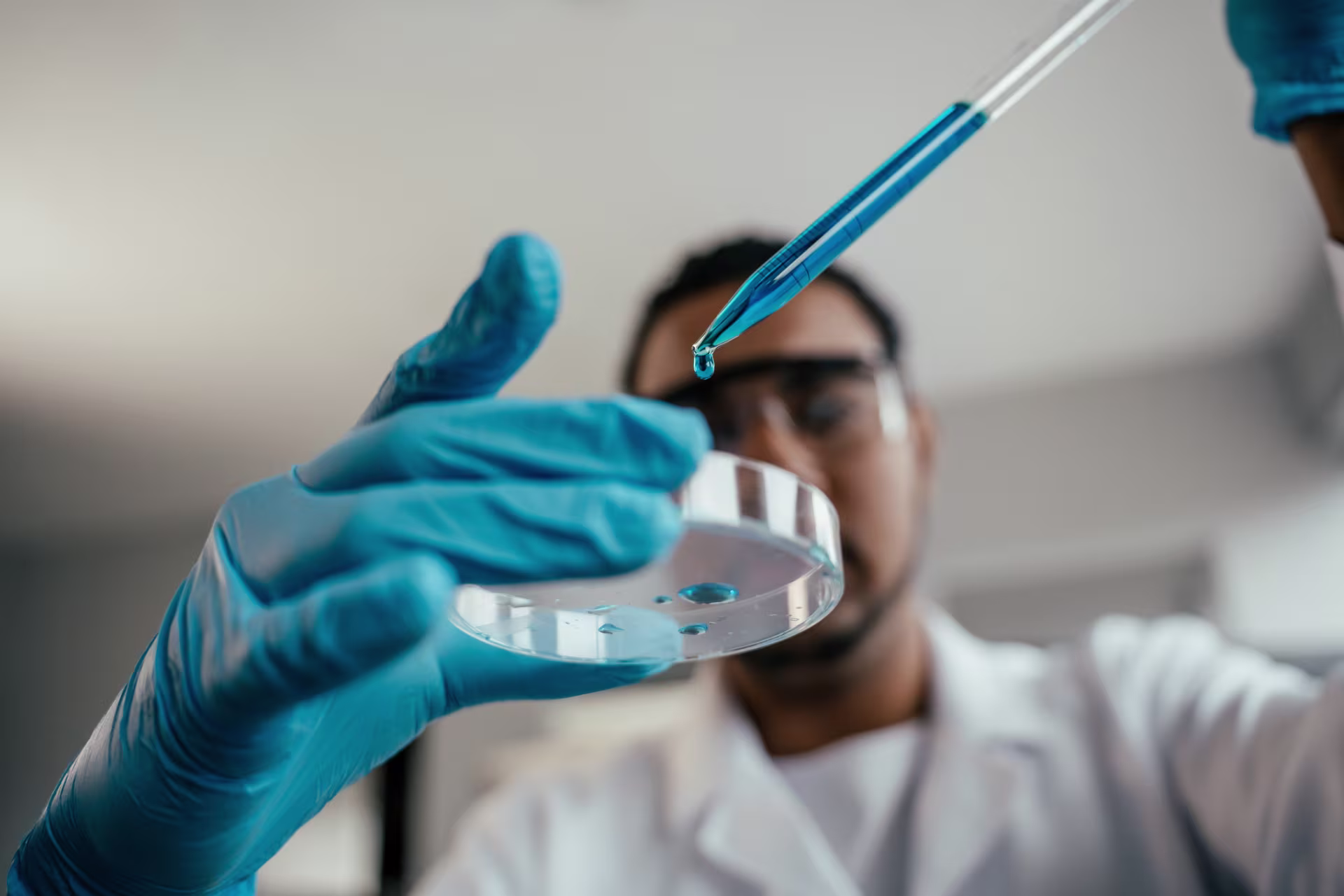 Biologist conducting experiment in lab.