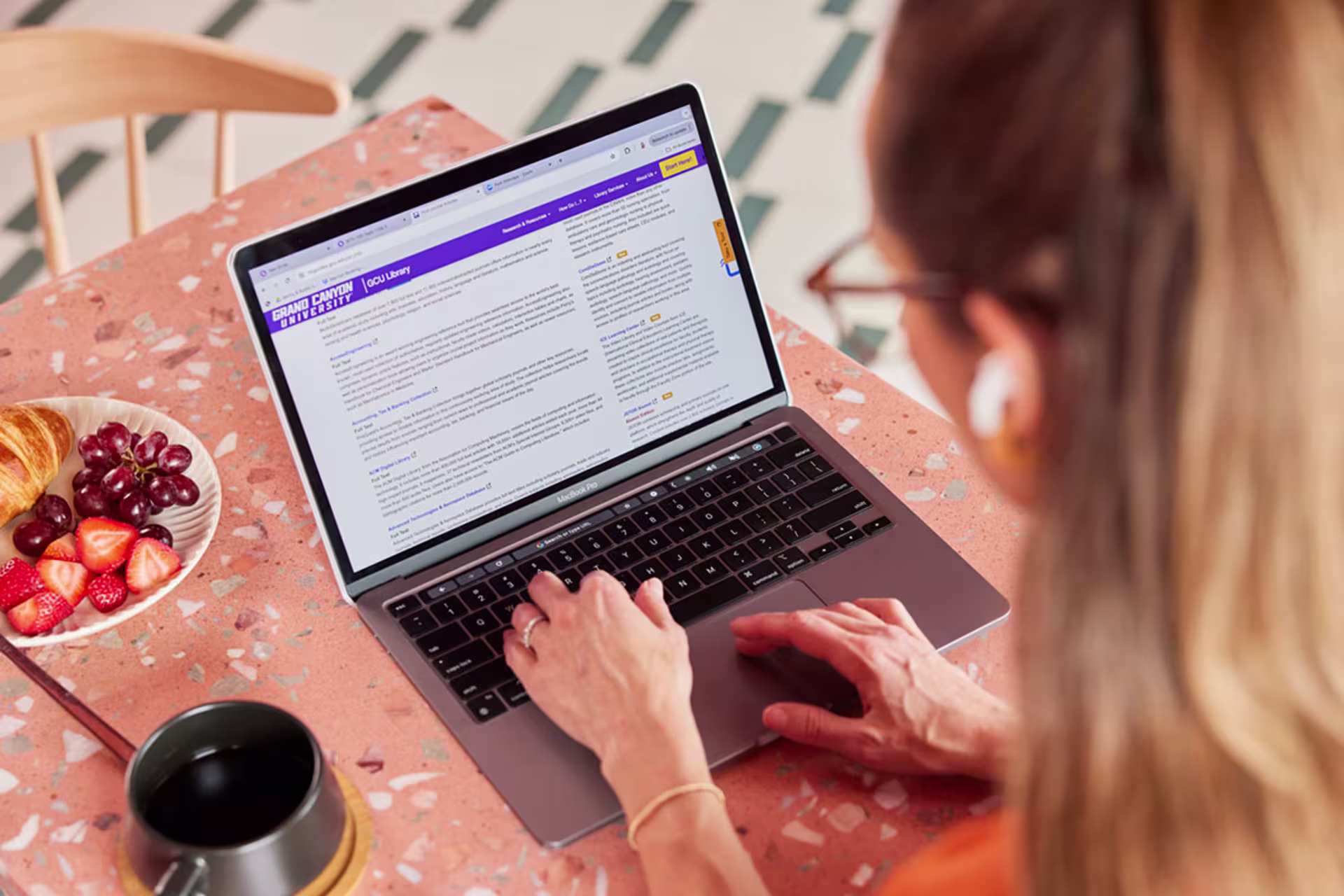 Female student working on her EdD program online.